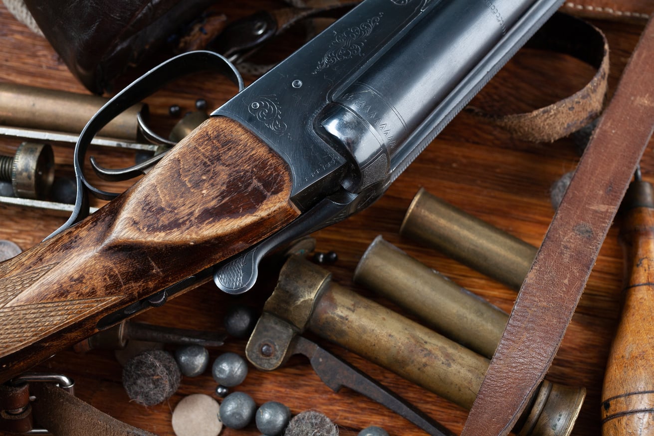 Smooth-bored shotgun with brass cases and accessories for cartridge reloading.